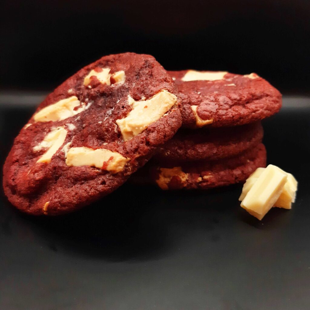 Red-coloured chocolate cookie white choc chunks